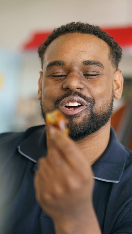 man eats a fresh date